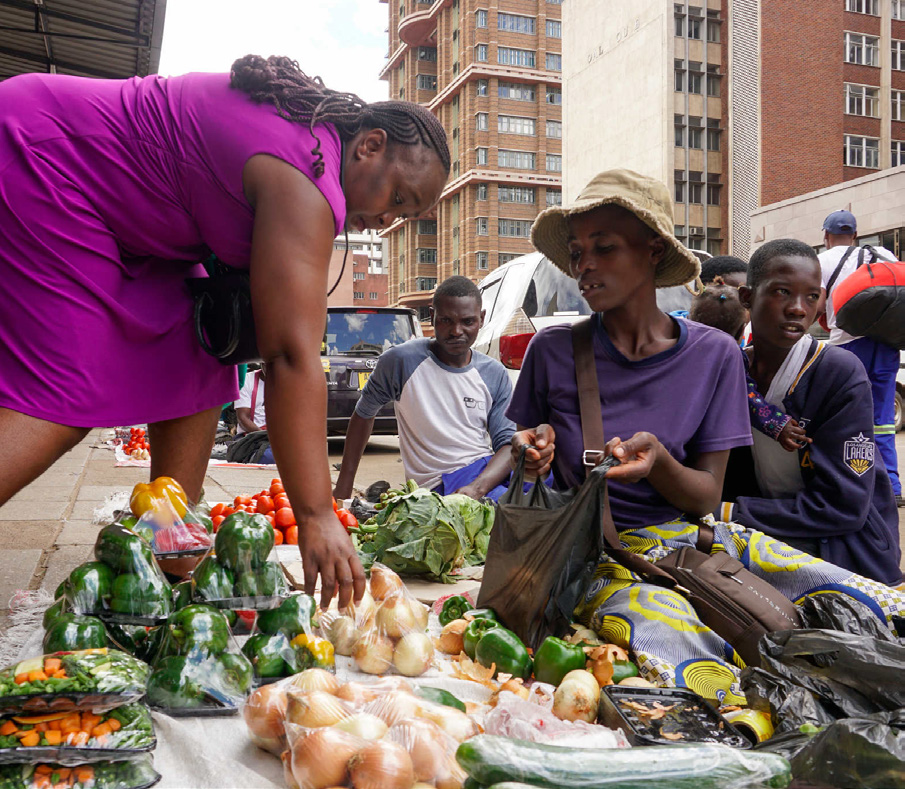 Street vendors selling produce at a Harare market